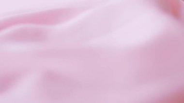 Moda markası arka planı, tekstil yüzeyi ve lüks düz malzeme olarak pembe ipek kumaş dokusu.