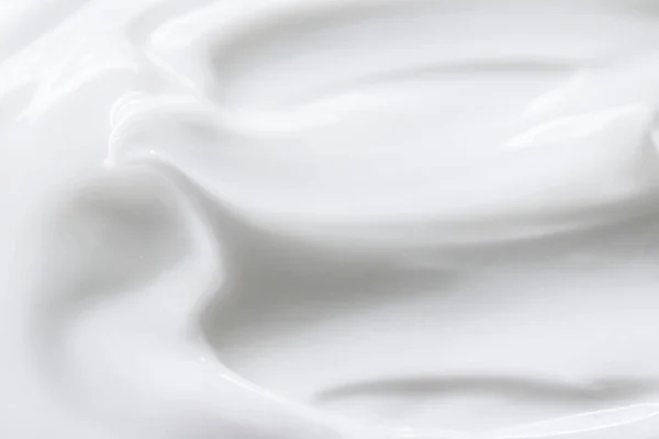 Pure white cream texture as abstract background, food substance or organic cosmetic