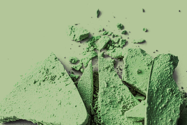 Green eye shadow powder as makeup palette closeup, crushed cosmetics and beauty texture