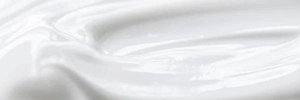 Pure white cream texture as abstract background, food substance or organic cosmetic