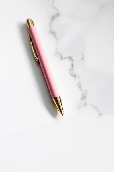 Pink pen on marble background, luxury stationery and business brand