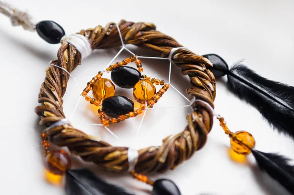 Dream catcher lying on a white background.