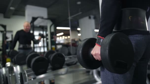 Close-up. Male hand lifts the dumbbell 4K Slow Mo — Stock Video