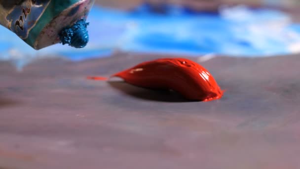 Close-up. Art palette. From a tube paint is beautifully squeezed out. 4K Slow Mo — Stock Video