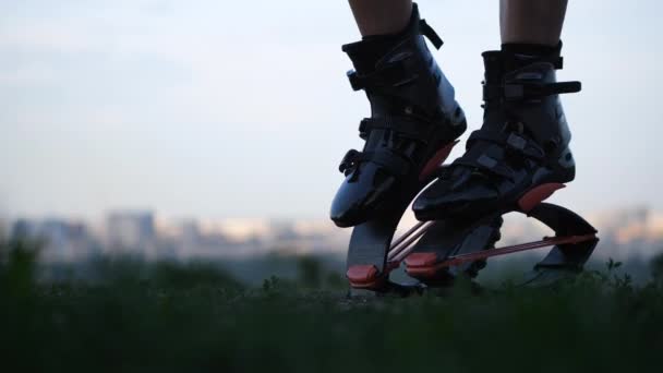 Close-up of womens legs in angoo jumps shoes. 4K Slow Mo — Stock Video