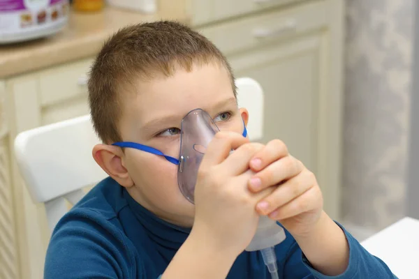 Boy breathes with inhaler — Stock Photo, Image