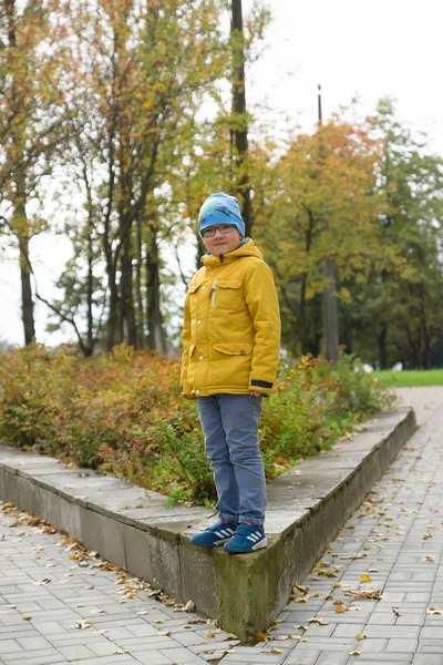 Boy in a yellow jacket — Stock Photo, Image