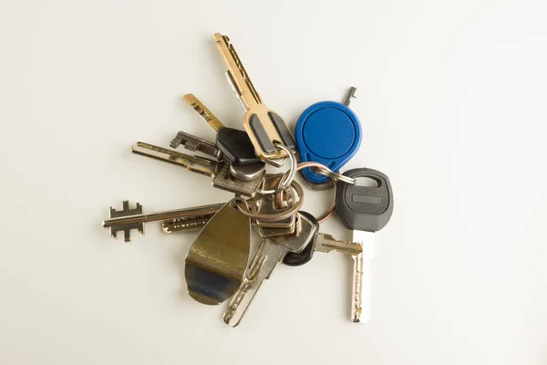 Large bunch of different keys isolated — Stock Photo, Image