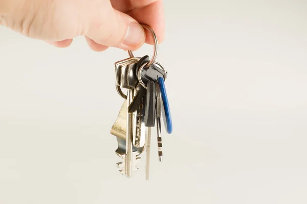 Big bunch of different keys in hand — Stock Photo, Image