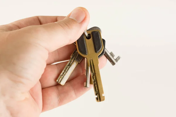 Big bunch of different keys in hand — Stock Photo, Image