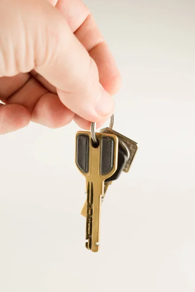 Big bunch of different keys in hand — Stock Photo, Image