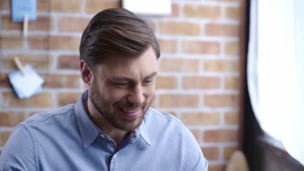 Laughing Man Blue Shirt Showing Yes Gesture Drinking Coffee Looking — Stock Video