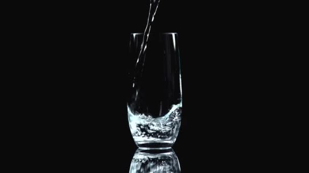 Studio Shoot Water Pouring Transparent Glass Isolated Black — Stock Video