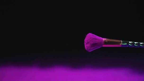 Slow Motion Shoot Purple Holi Paint Falling Cosmetic Brush — Stock Video