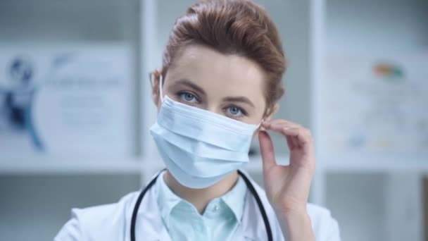 Beautiful Doctor Taking Medical Mask Smiling Looking Camera — Stok video