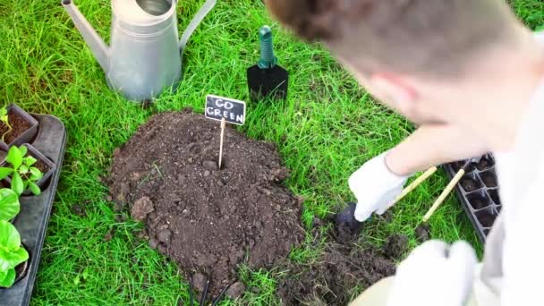 Partial View Gardener Using Shovel While Working Garden Grass — Stock Video