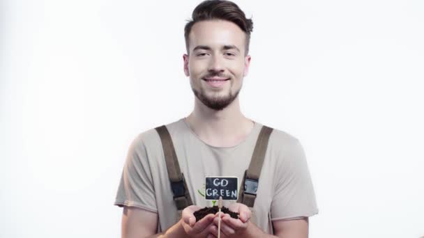 Front View Handsome Gardener Holding Handful Soil Green Sprout Smiling — Stock Video