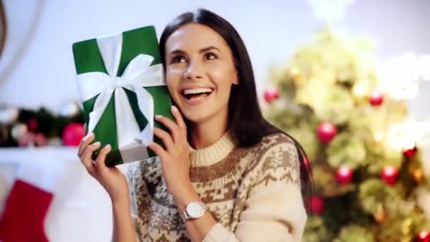 Happy Young Woman Holding Gift — Stock Video