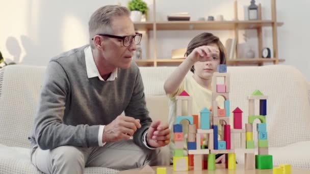 Happy Grandfather Grandson Hugging Playing Building Blocks — Stock Video