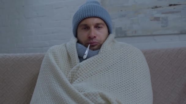 Sick Man Warm Hat Wrapping Blanket Measuring Temperature — Stock Video