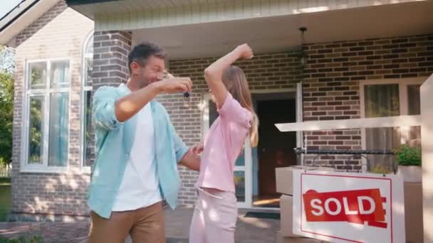 Man Giving Keys Joyful Wife Jumping New House — Stock Video