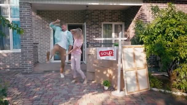 Joyful Couple Jumping Dancing Boxes New House — Stock Video