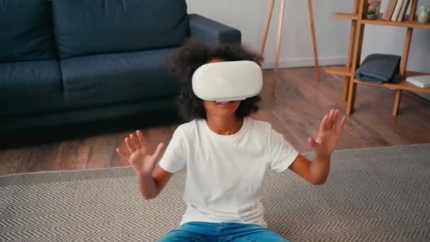 African American Girl Wearing Headset Gesturing Sitting Carpet — Stock Video