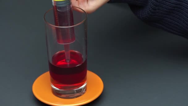 Partial View Woman Filling Confectionery Syringe Red Liquid Glass — Stock Video