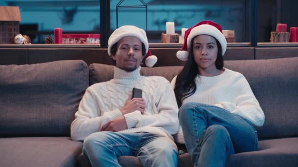 African American Couple Santa Hats Fighting Remote Controller — Stock Video