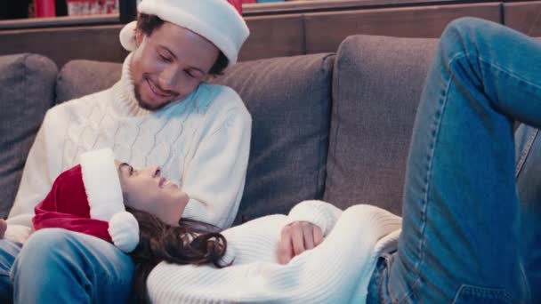 African American Man Santa Hat Sticking Out Tongue Woman Cough — Stock Video