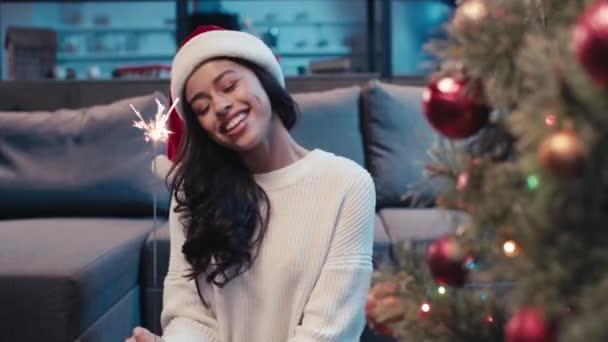 African American Woman Holding Sparkler Showing Peace Sign Christmas — Stock Video