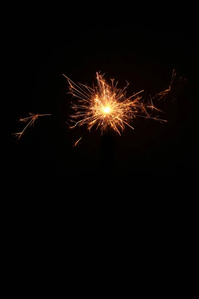 yellow sparks on a black background