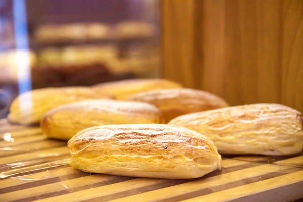 Baked goods. Close up of fresh yummy baked goods on window display.