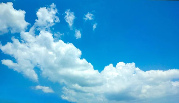 beautiful blue sky white cloud in cloudy day. natural background - many white clouds in summer blue sky.