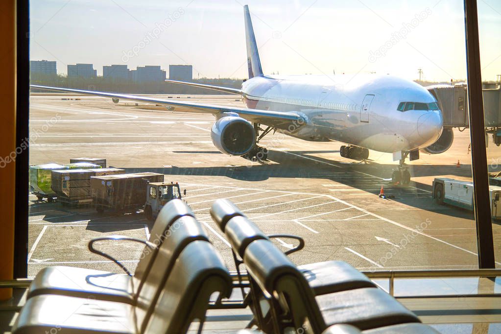 Passenger planes at the airport, view through window.