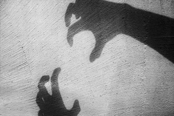 a big monster claw shadow Hallowween concept on wall.