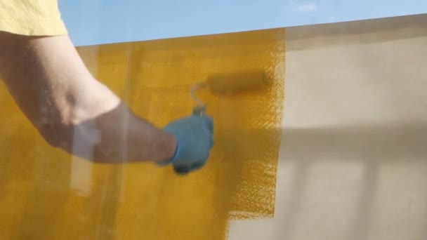 Hands Working Roller Coloring Yellow Paint — Stock Video