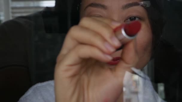 Asian Woman Paints Her Lips Burgundy Color Lipstick Paints Heart — Stock Video