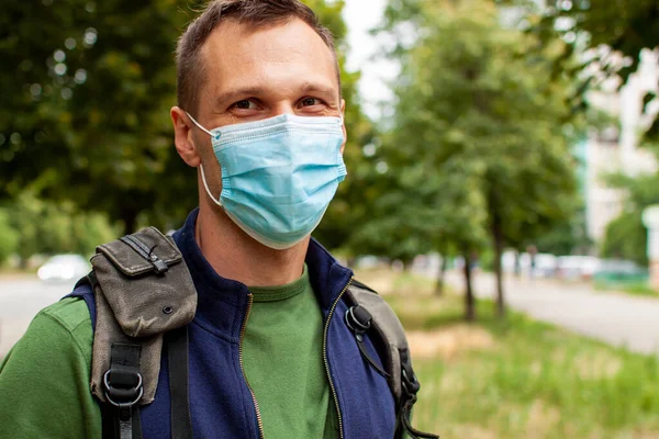 stock image Man Wearing Antibacterial Mask Using Phone In A City Of Ukraine.
