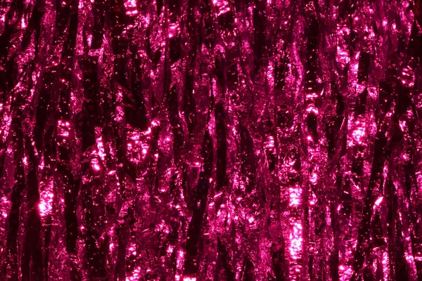 Plastic sheet metal shiny. When it hits light it will reflect.Put together Use as a beautiful backdrop. Feel like a pink metal curtain.