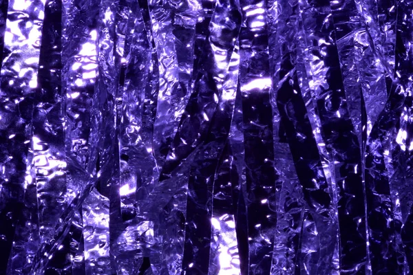 Plastic sheet metal shiny.When light hits, it will reflect.Put together a beautiful backdrop. Feel like a purple metal curtain.