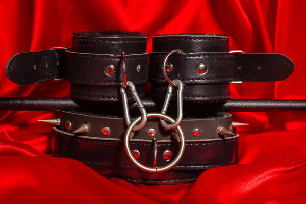 Close up bdsm outfit. Bondage, kinky adult sex games, kink and BDSM lifestyle concept.