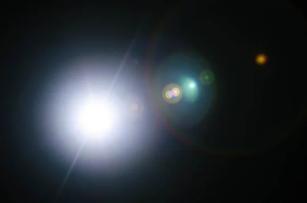 Abstrato Sinal de Sol Natural ou Estrela distante no fundo preto — Fotografia de Stock