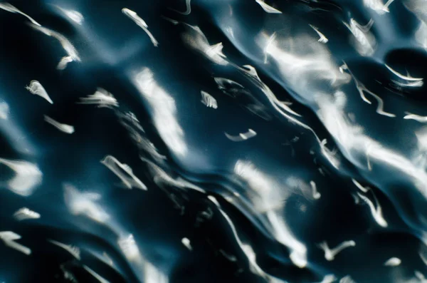 Close up texture of water under the influence of vibration in 432 hertz