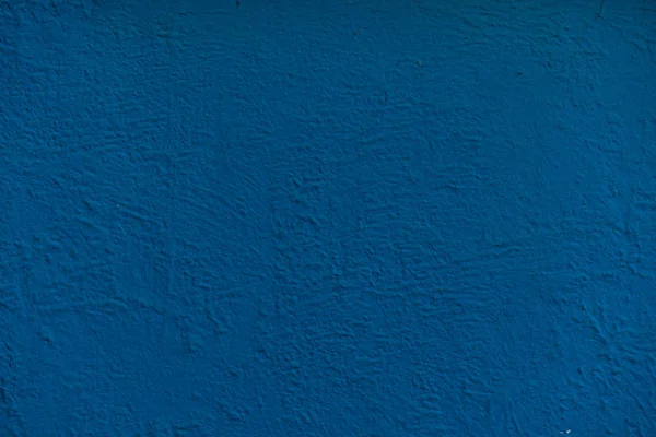 Blue background facade plaster. Exterior building structure backdrop.