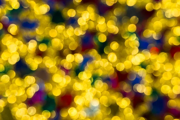 Abstract golden color lights chrismas background. de-focused - image