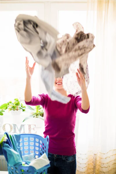 Young Smiling Woman Standing Room Throwing Clothes — Stock Photo, Image