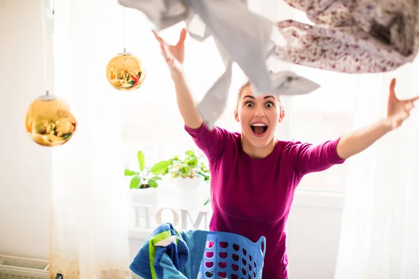 Young Joyful Woman Standing Room Throwing Clothes — Stock Photo, Image