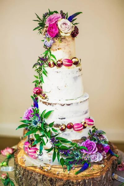 The beautiful big cake with flowers indoors