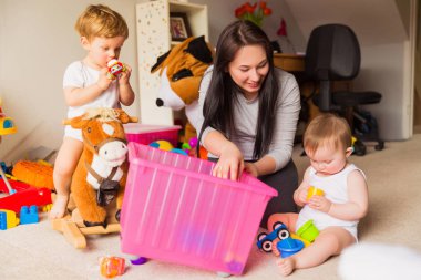 babysitter playing with children clipart